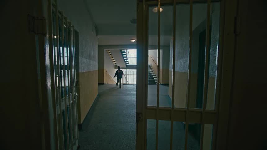 A child walking through the hallways of a school