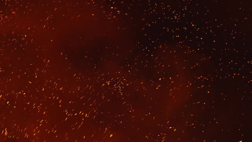 Smoke and particles rise through the night sky