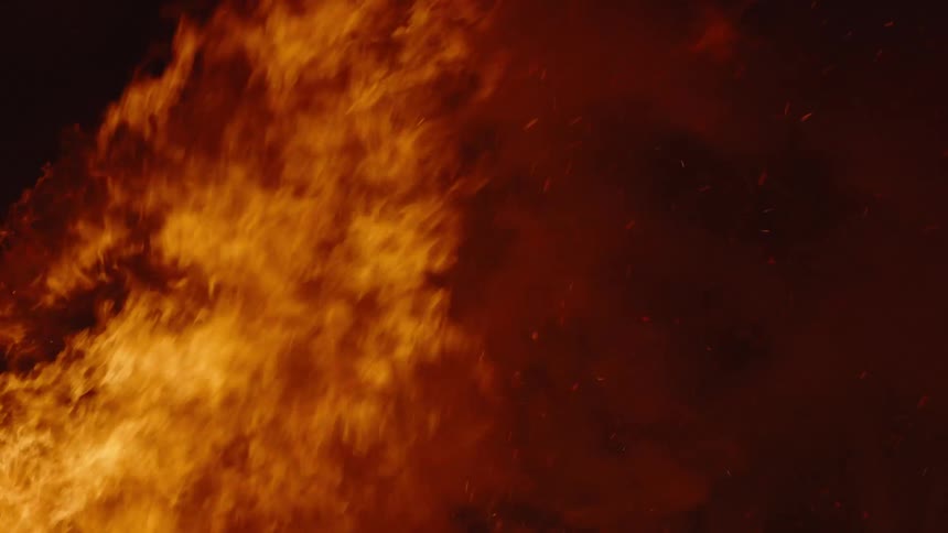 Fire and combustion rising with a lot of smoke at night
