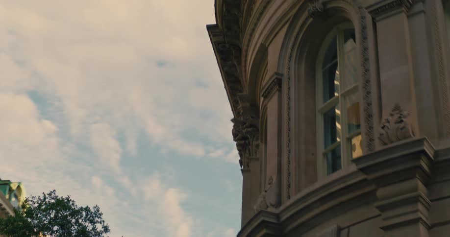A classically designed building in a city corner