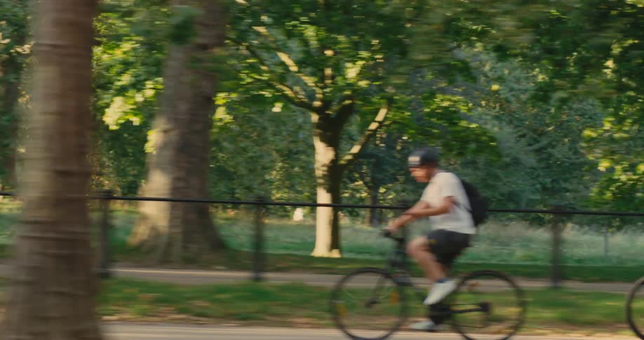 People cycling along a city park