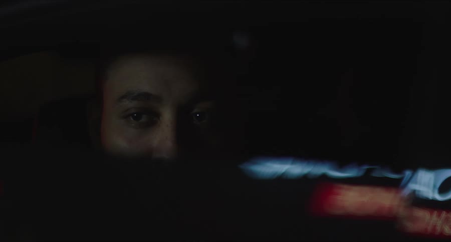Closeup of a mans face sitting in a car