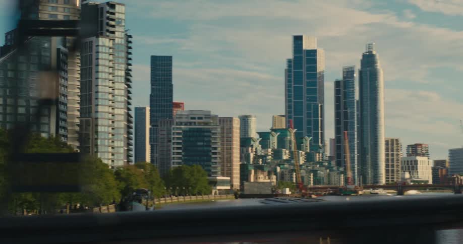 Landscape of a seaside metropolis with skyscrapers on a blue sky day with clouds