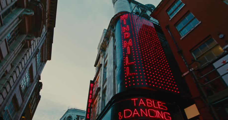 Buildings illuminated during the day and half a metropolis