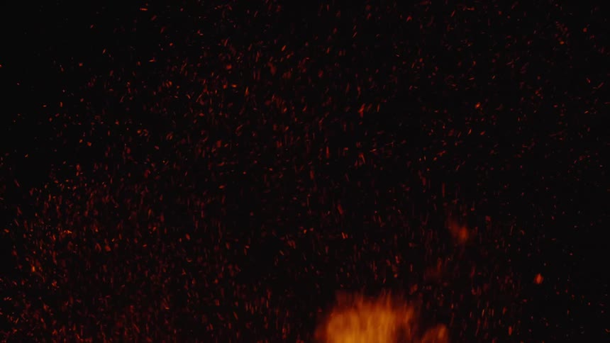 Flames of fireworks and shrapnel rising at night