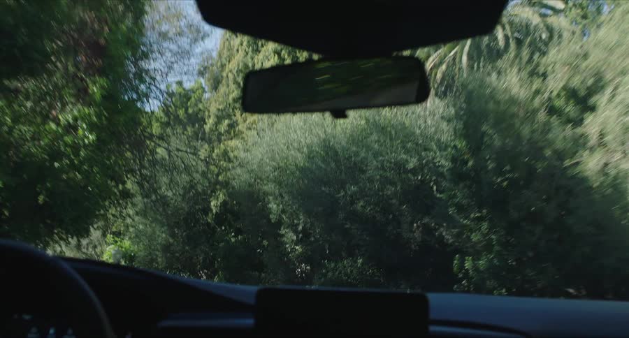 An interior view of a car moving on the road