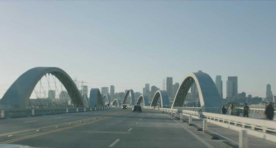 Panorama of vehicles traveling over a bridge with access to downtown Los Angeles