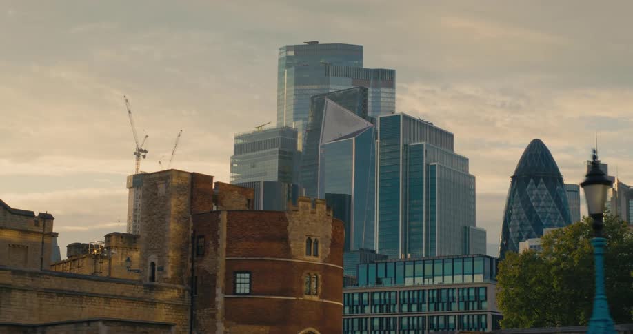 Mirrored skyscrapers in urban city during sunset