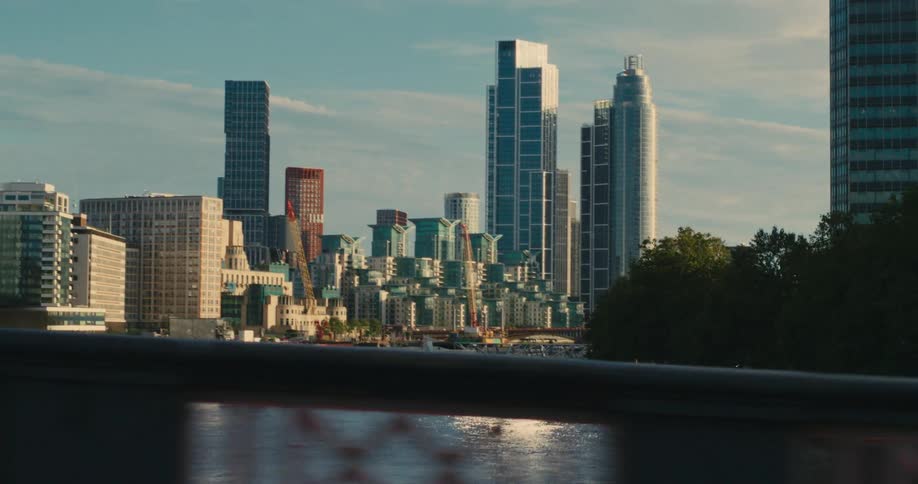 A block of a city with several tall buildings and there is a river
