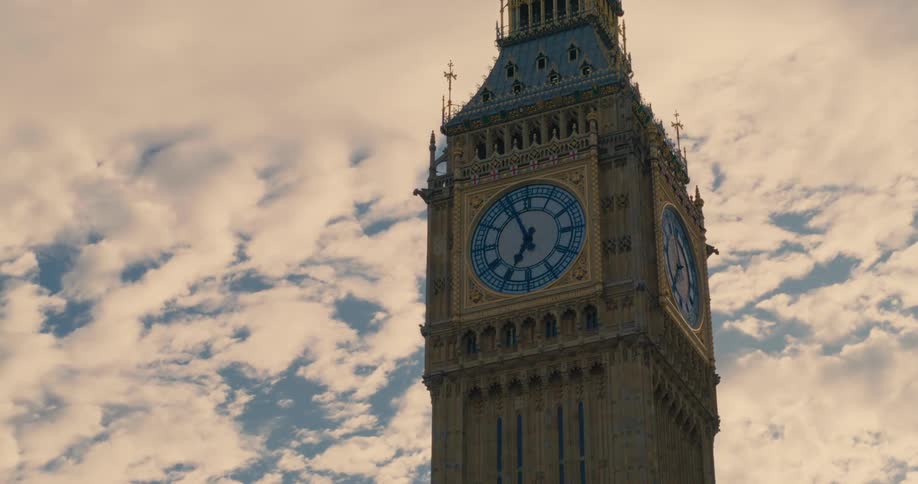 Closeup of big ben clock tower on a mostly cloudy day