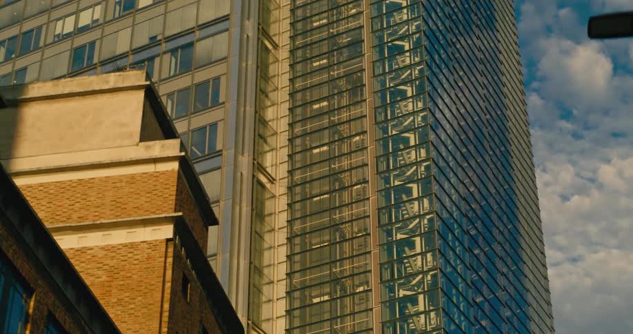 A huge office building with a large glass wall