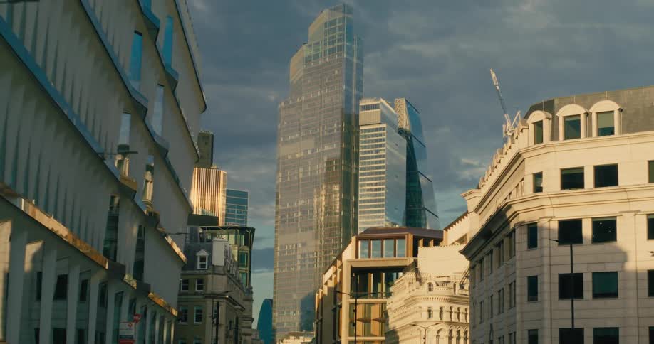 View of commercial and residential buildings with skyscrapers on a cloudy sky day