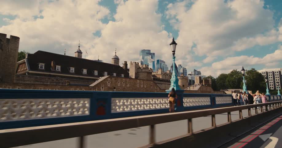 Panorama of a bridge with people walking and a view of residential and commercial buildings