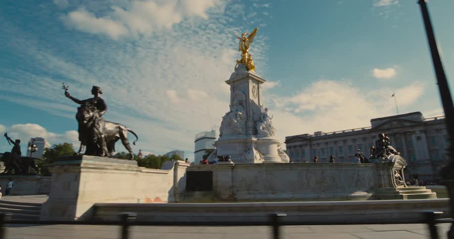 Tourists visit the statues in the city