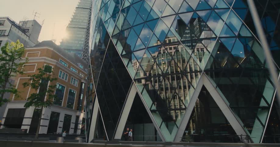Spiral building in the middle of a modern mirrored metropolis