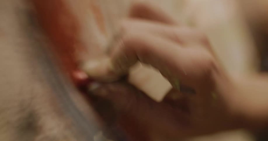 A person is drawing on a canvas