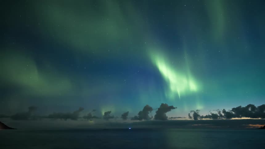 The aurora in the sky is bright and green
