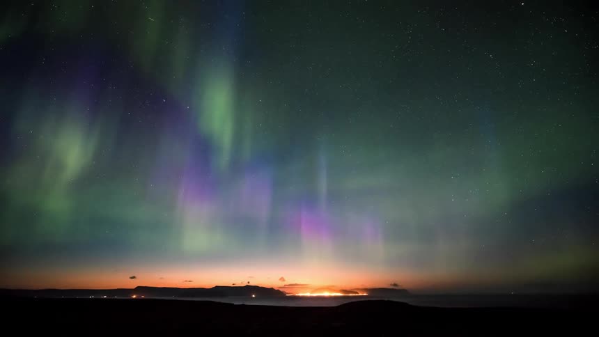 The sky is bright with northern lights