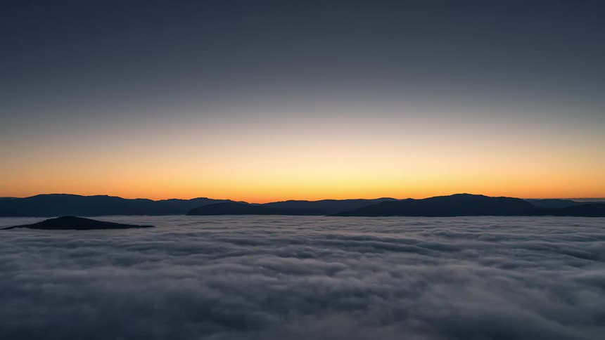 The sun rises over the mountains