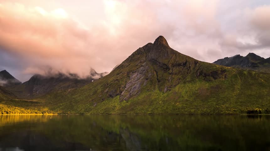 The lake water is reflecting the heavy clouds