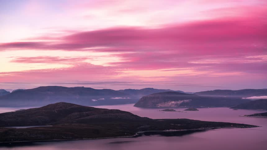 Landscape of islands in leomar with the sky in reddish timelapse and turning purple