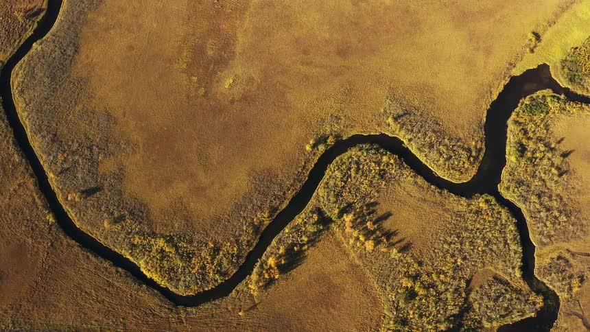 Aerial panorama of rivers amid fields