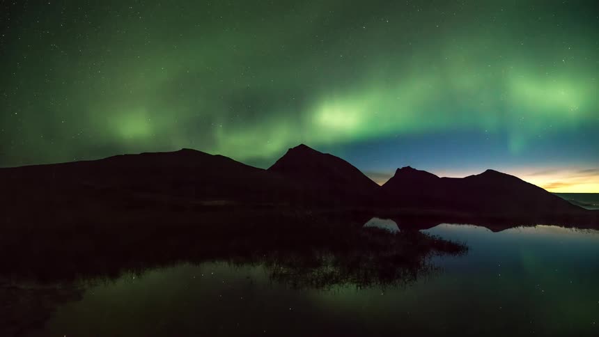 Night landscape of northern lights over ruins and lakes
