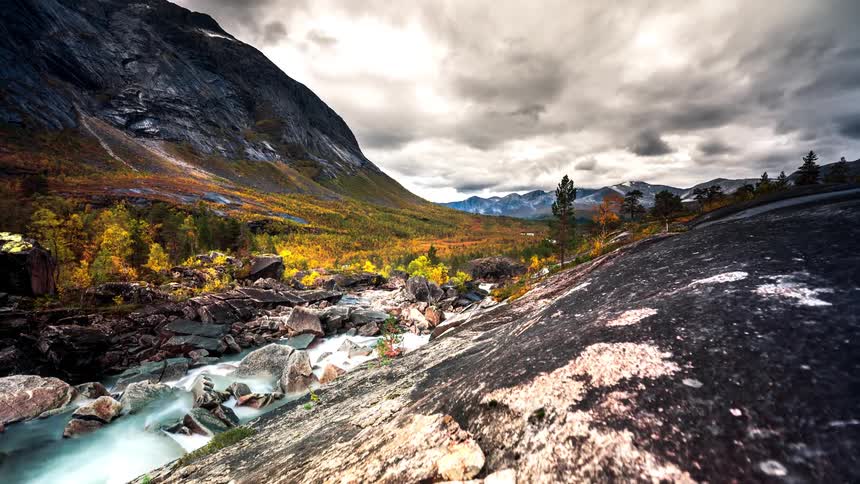 The stream runs through the valley