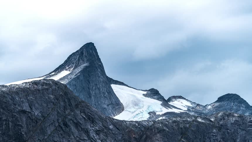 Time lapse of a snowy mountain peak