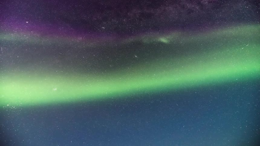 The sky is green and full of stars