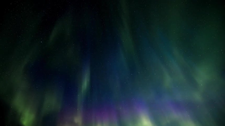 The lights of a bright aurora borealis in a night sky