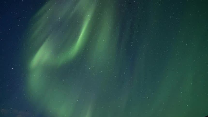 Sky view with aurora borealis over ruins and mountains at night
