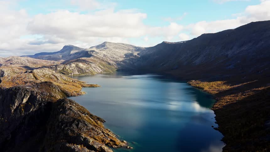 Aerial of a lake surrounded by barren mountains
