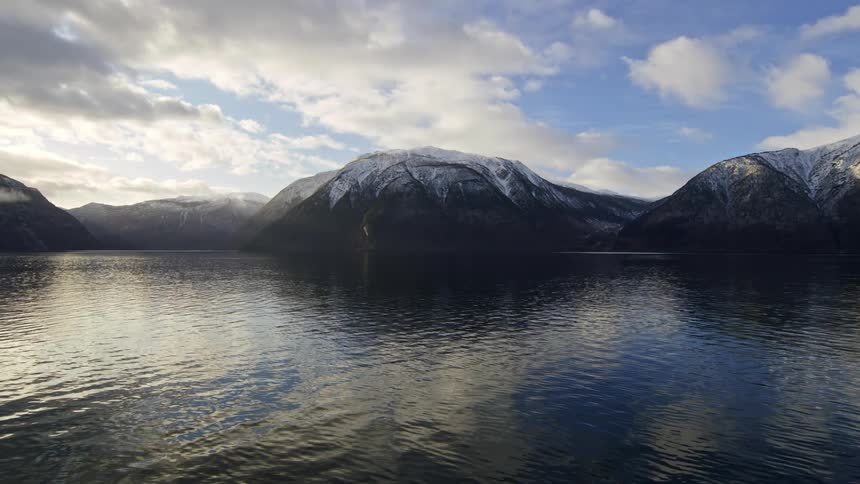 Snow covered mountains near the sea