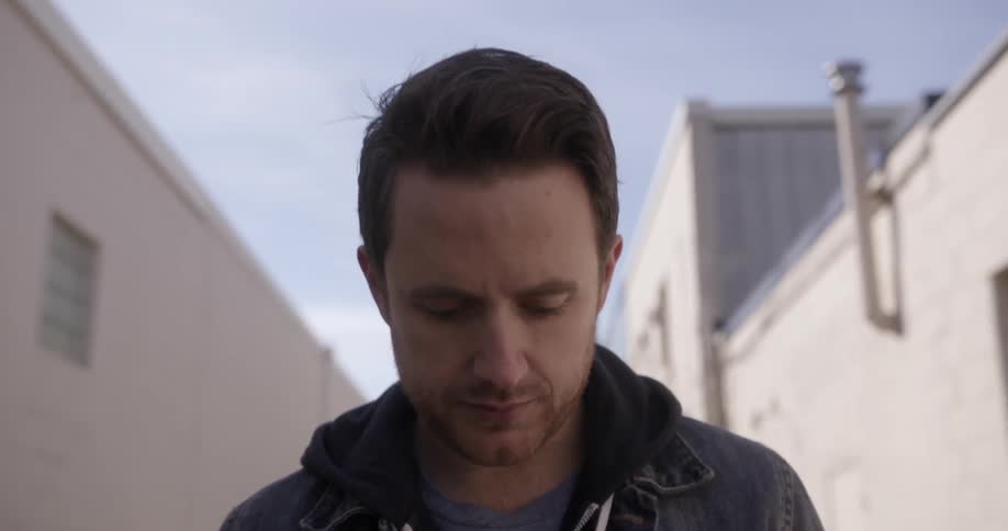 A man walks down a alley