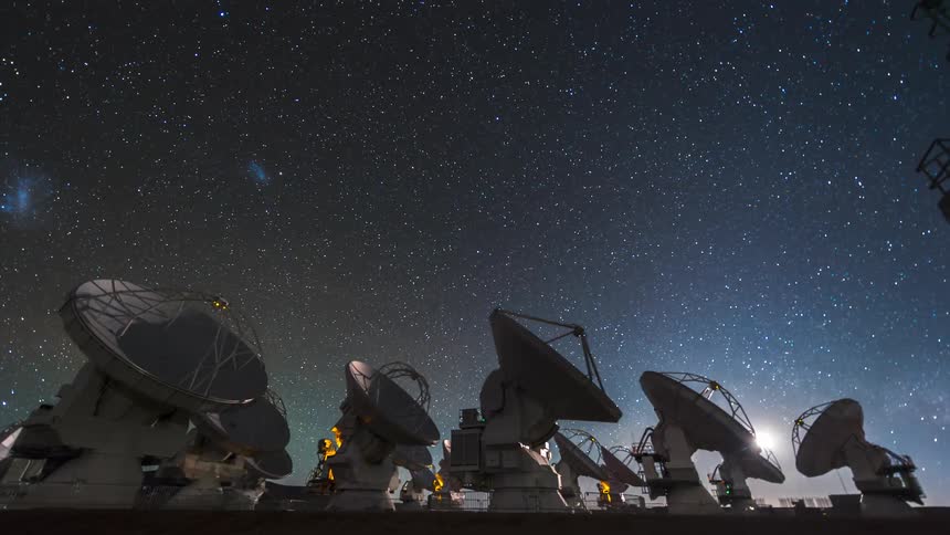 Panorama of scientific antenna pointed upwards analyzing the sky with stars
