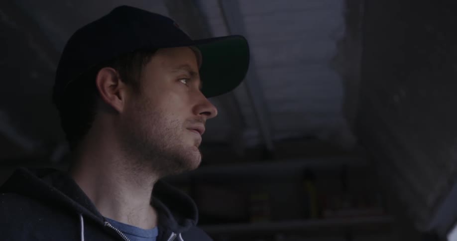 A man staring off in the distance looking at something