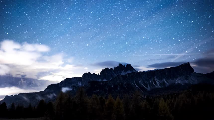 Night turns to day over a mountain range