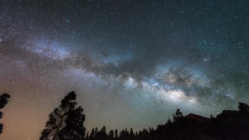 A time lapse shows a stunning view of the night sky filled with stars and galaxies