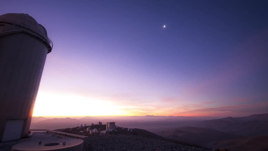Towers in the middle of a hill overlooking the sky in timelapse of the day at dusk