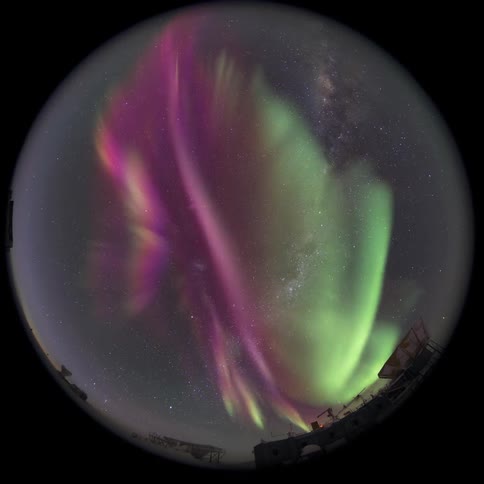 fisheye view pointed at the sky with the Aurora Australis at night