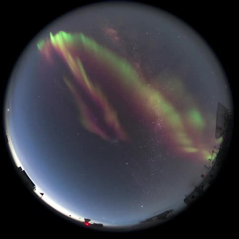 fisheye view pointed at the sky with Aurora Australis at night