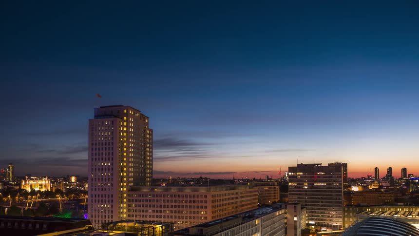 Panorama of a metropolis with a day passing in timelapse and dawn