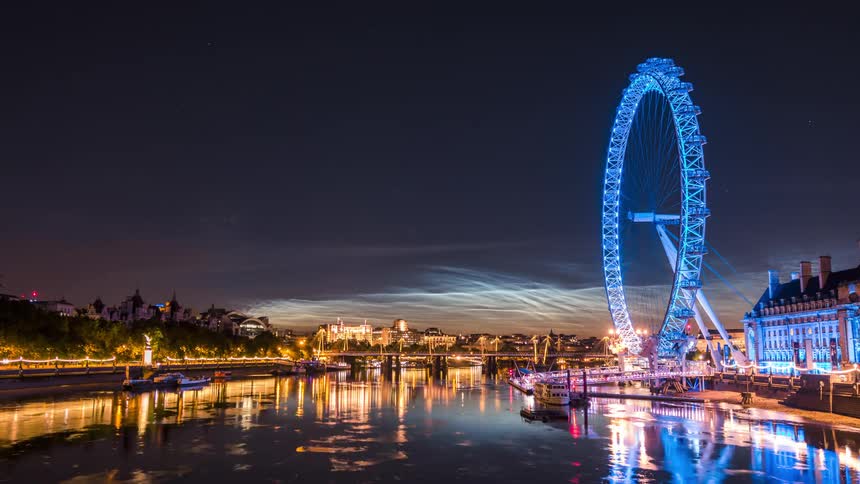 Landscape of ferris wheel in a waterfront park at night