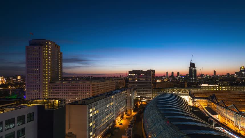 Panorama gave a metropolis with skyscrapers with a day dawning in timelapse