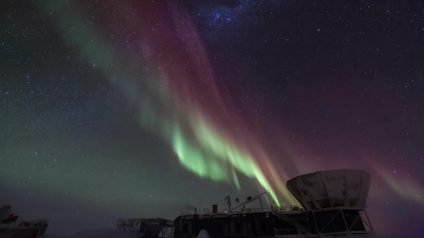 Observatory overlooking the sky with Aurora Australis at night