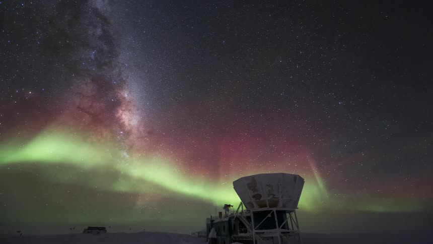 observatory at the south pole with a view of the sky with the Aurora Australis