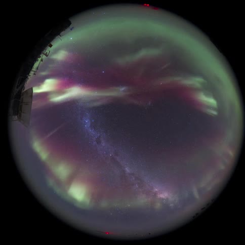 fisheye view of a telescope and Aurora Australis