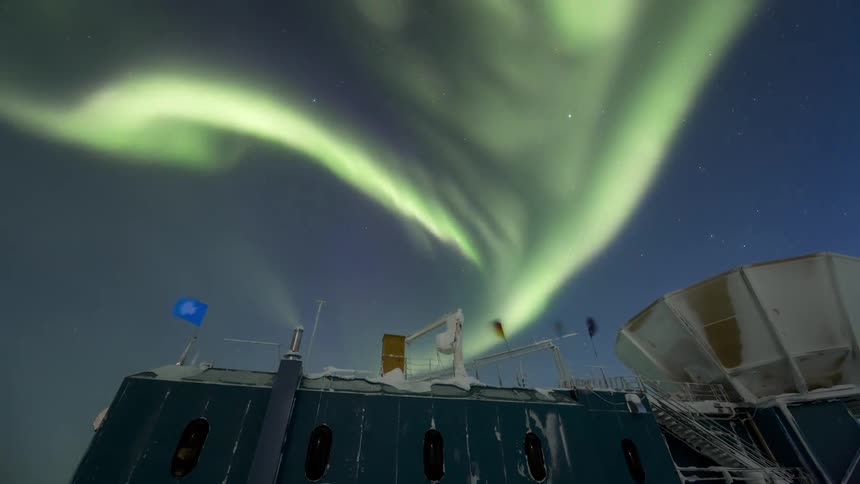 The aurora is shining over the satellite dish