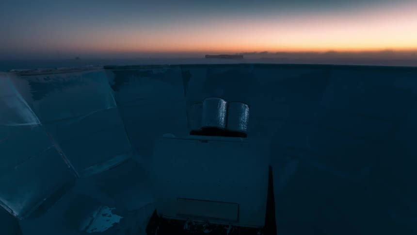 Closeup of a telescope in antarctica in a morning sky